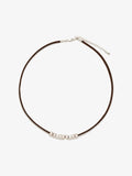 Fairyokai Balance Glide necklace with brown leather cord and textured silver bead on white background.