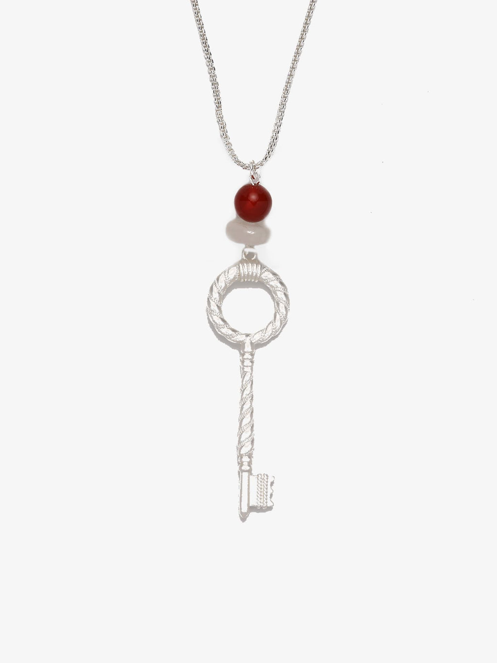 Fairyokai Dream Key red agate crystal key pendant necklace on white background.