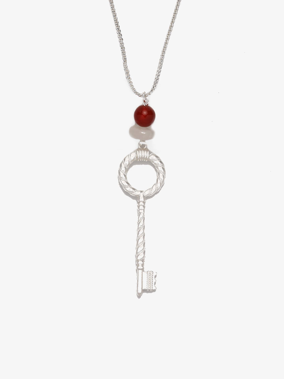 Fairyokai Dream Key red agate crystal key pendant necklace on white background.