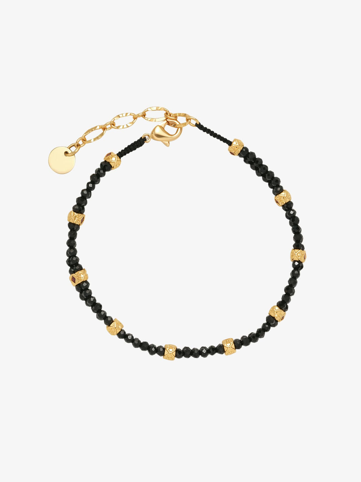 One Fairyokai Rhythm Between double-layer black spinel bracelet on a clean white background, with black beads, gold-tone accents, and adjustable cord ends.