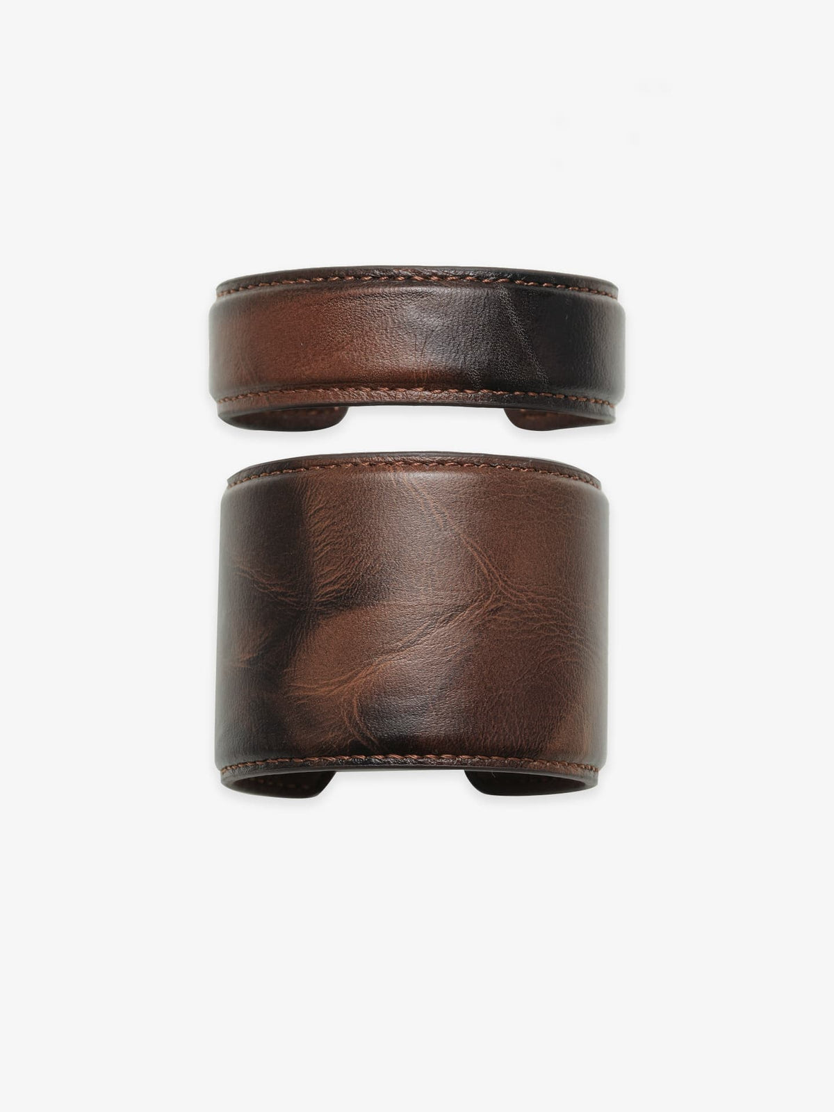 Two Fairyokai Vein Cuff PU leather bracelets on a clean white background, shown as a stacked set with dark brown leather texture.