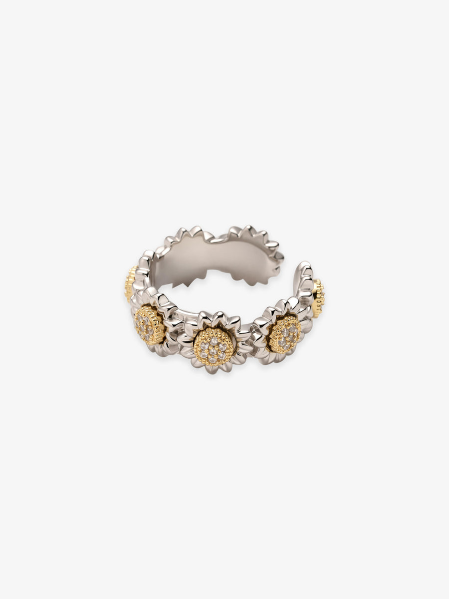 One Fairyokai Wild Daisy gold textured zircon ring on a clean white background, with clustered daisy shapes and clear zircon accents.